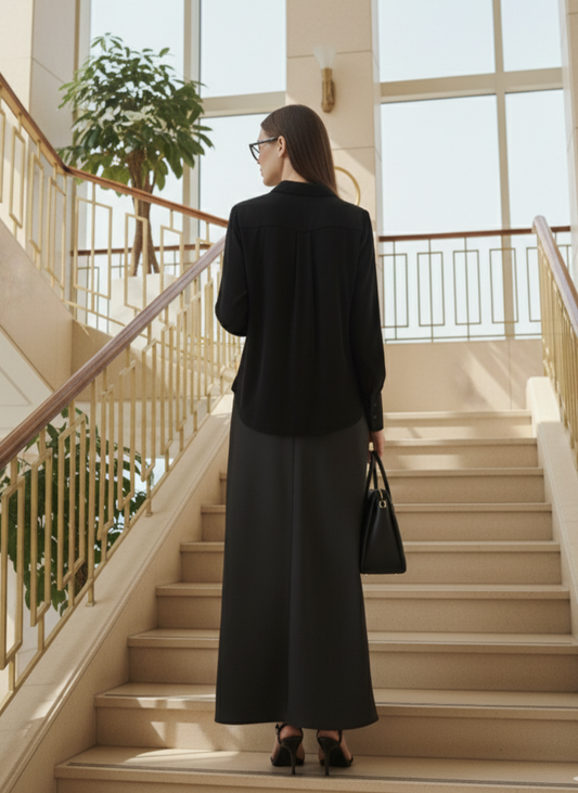 Back view of black asymmetrical shirt in rose fabric, relaxed fit and elegant drape Moon N Lotus