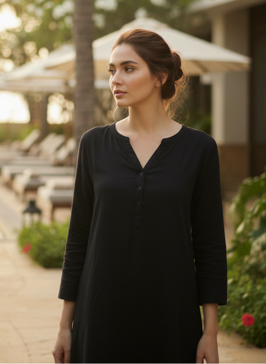 Close-up of polka cuff detail on black rose fabric kurta dress, minimal elegant design