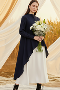 Woman in navy high-low corn fabric shirt holding white flowers by Moon N Lotus