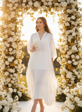 Woman wearing white bamboo kaftan by Moon N Lotus