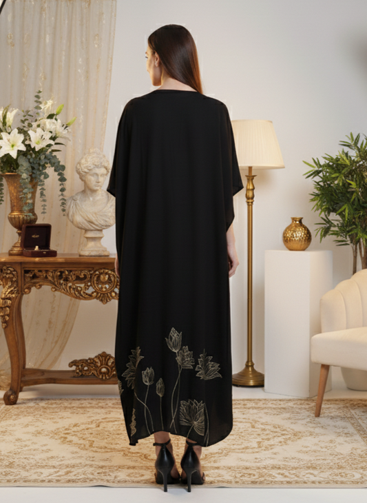 Close-up of floral foil detailing on black kaftan, elegant subtle shine Moon N Lotus