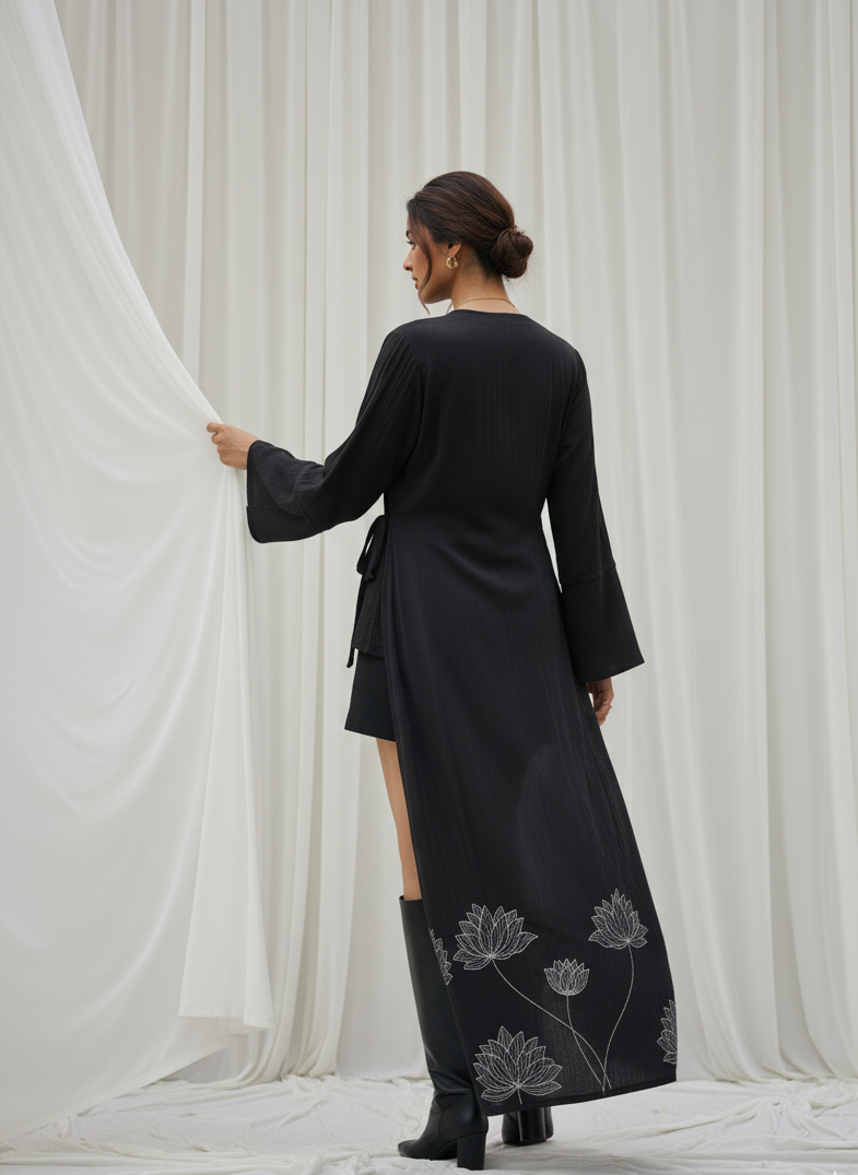 Close-up of floral foil detail on black kimono wrap in rose fabric, refined shimmer design Moon N Lotus
