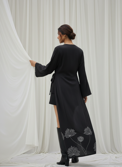Close-up of floral foil detail on black kimono wrap in rose fabric, refined shimmer design Moon N Lotus