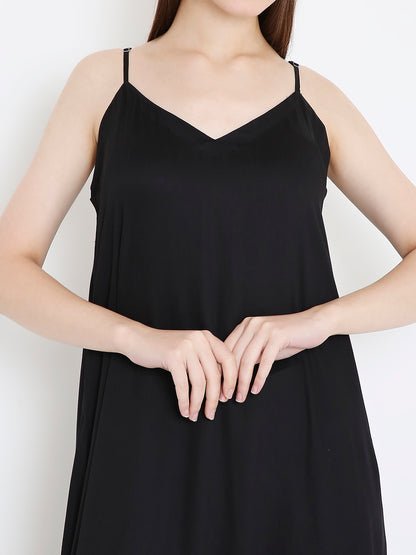 Close-up of floral foil detailing on black slip dress, elegant subtle shine Moon N Lotus