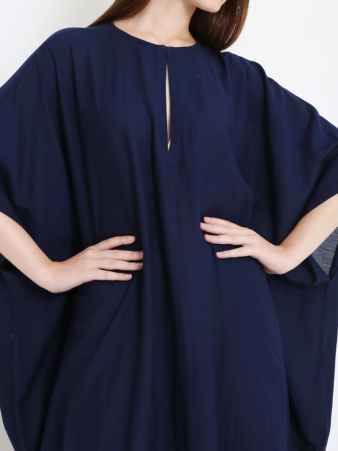 Close-up of floral foil detailing on navy kaftan, elegant minimal shine Moon N Lotus