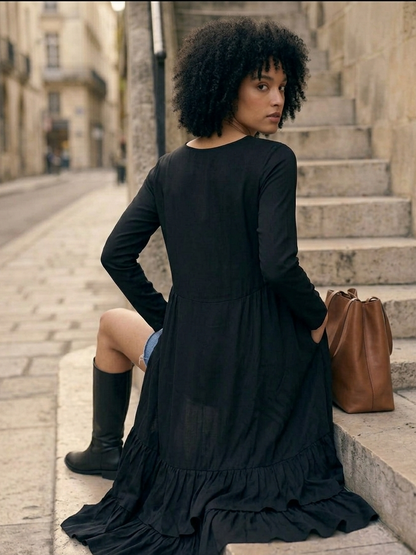 Close-up of frill detailing on black top, soft fluid design Moon N Lotus