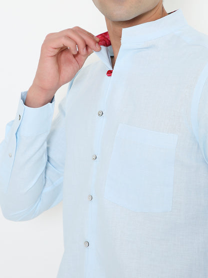 Close-up of mandarin collar on blue cotton hemp shirt, minimal premium design Moon N Lotus