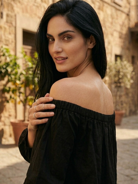 Close-up of off shoulder neckline on black dress, feminine elegant design Moon N Lotus
