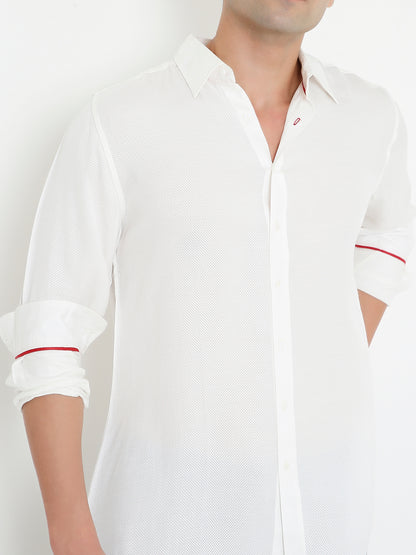 Close-up of orange fabric on white shirt, premium breathable design Moon N Lotus