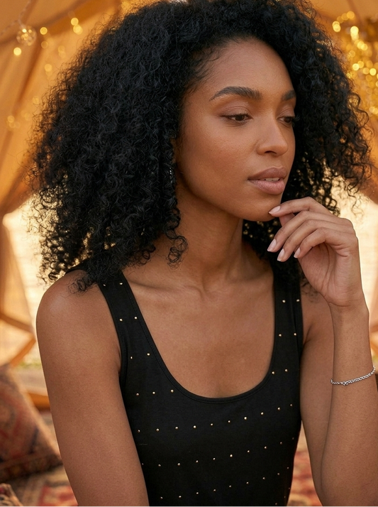 Close-up of polka dot print on black cami top, playful modern design Moon N Lotus