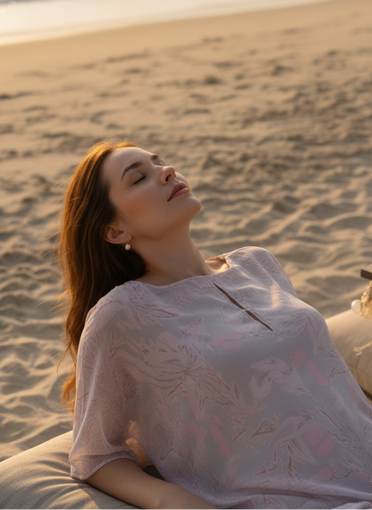 Close-up of pink and grey print on orange Hawaiian kaftan, soft artistic detailing Moon N Lotus