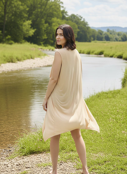 Back view of sleeveless shrug in orange fabric with relaxed silhouette Moon N Lotus